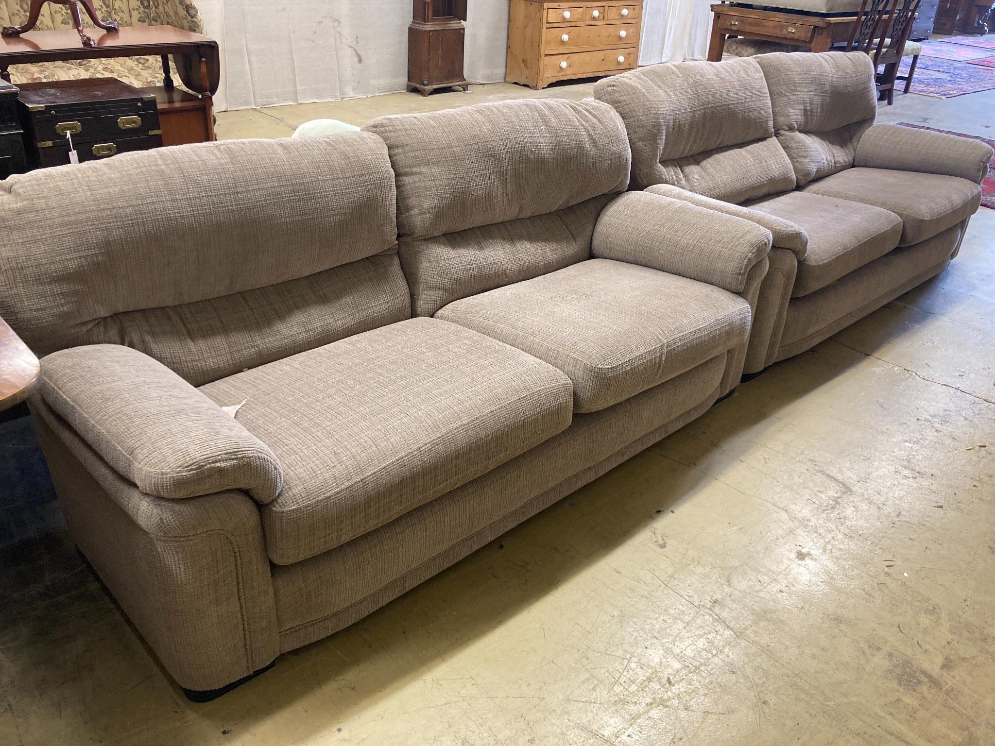 Two matching contemporary four-seater settees with grey/brown upholstery, length 200cm, depth 100cm, height 88cm
